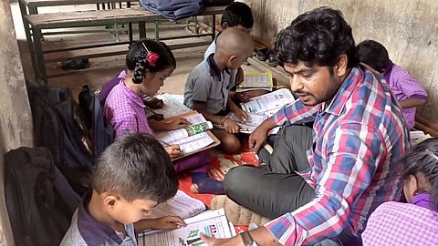 Kouluri Rajesh with students.