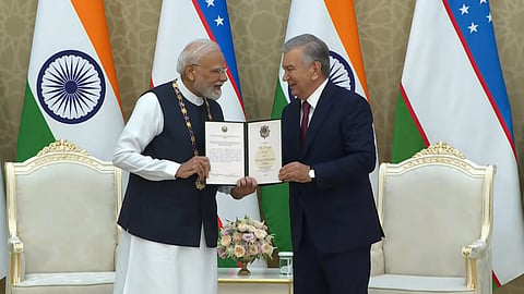 Prime Minister Narendra Modi being conferred with Uzbekistan's prestigious 'Oliy Darajali Do'stlik' by Uzbekistan President Shavkat Mirziyoyev, at the Kuksaroy Presidential Palace in Tashkent, Uzbekistan. 
