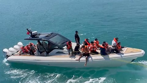In this frame grab from video, rescued passengers wearing life jackets are evacuated by boat after a passenger vessel capsized off the coast of Girne, in the Turkish-occupied northern part of Cyprus, Sunday, Aug. 30, 2026.