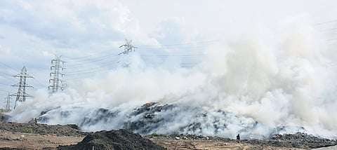 Fire personnel fighting the blaze at the Kodungaiyur dump yard on Sunday. In June, at least two fires were reported at the dump yard in a week’s span  