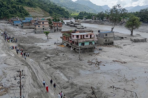 In this photo released by Xinhua News Agency, a drone photo shows a flood-hit area in Nuwakot, Nepal.