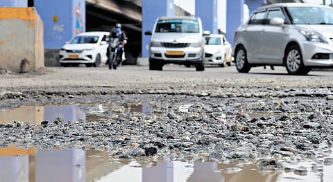 A damaged stretch of road under the Silk Board junction flyover  