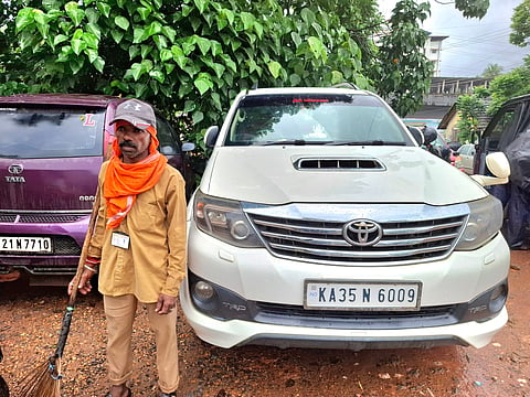 Sesappa with his used Toyota Fortuner, which he bought after years of hard work