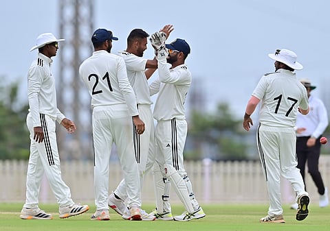 Vidwath Kaverappa (3rd from L) celebrates with teammates on Sunday