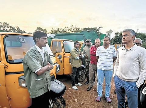 Bengaluru Development Minister Krishna Byre Gowda checks door-to-door waste collection auto tippers. 