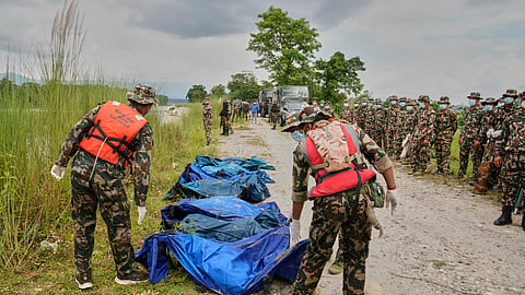 Nepalese army soldiers recover bodies of flash flood victims from a river in Chitwan, Nepal, Monday, Aug. 31, 2026.