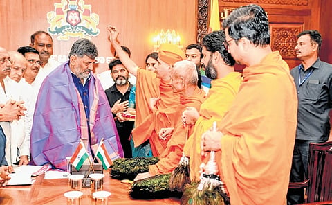Jain monks bless CM DK Shivakumar at Vidhana Soudha in Bengaluru on Monday. 