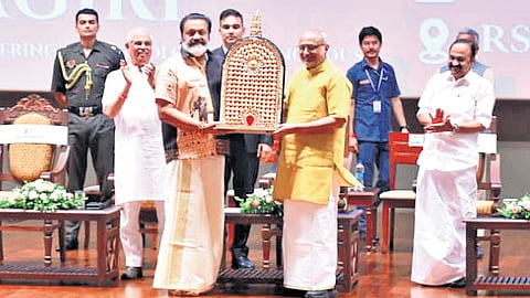 Union Minister Suresh Gopi presents a memento to Vice-President C P Radhakrishnan, who arrived to inaugurate the silver jubilee celebrations 
of Rajagiri School of Engineering and Technology on Monday