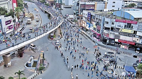 Runners participate in the 15th edition of the NMDC Hyderabad Marathon in Hyderabad on Sunday.