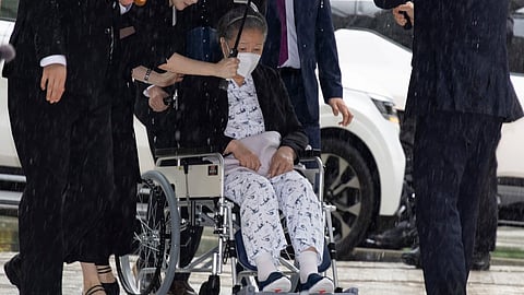 Unification Church leader Hak Ja Han, on the wheelchair, arrives for the sentencing hearing on allegations of bribery and political funding, at the Seoul Central District Court in Seoul, South Korea, Monday, Aug. 31, 2026.