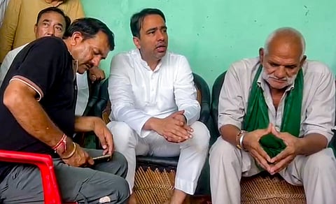 Union MoS Jayant Chaudhary with family of the singer on Monday.