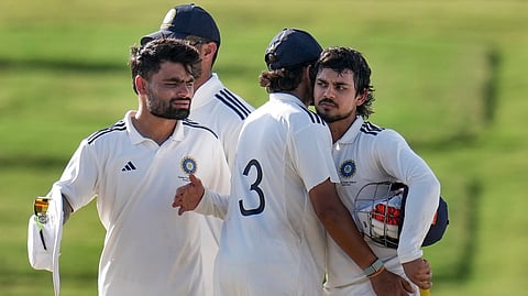 Ishan Kishan celebrates with teammates after winning the match