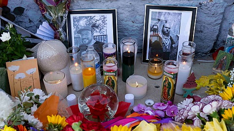 A growing memorial sits outside the Venture-N Bar in Tucson, Ariz., Tuesday, Sept. 1, 2026, for Vincent Siquieros and Cameron Capara, pictured, who were fatally shot in the parking lot of the gay bar shortly after midnight Monday.