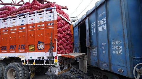Workers load sacks of onions on a truck from the first ‘Kanda Express’ that arrived from Nashik.