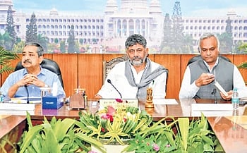 CM DK Shivakumar, Home Minister Priyank Kharge and NITI Aayog Vice-Chairman Ashok Kumar Lahiri, during a meeting in Bengaluru on Wednesday
