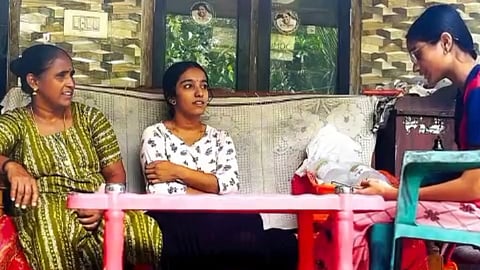 An NSS volunteer of GVHSS Vithura (right) creates awareness about various lifestyle diseases during a house visit as part of the ‘Freedom From Lifestyle Diseases’ campaign. 