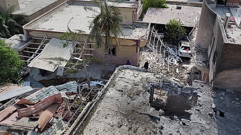 An aerial view shows the apparent point of impact on the roof of a building that Iranian media said was hit by a U.S. strike while a wedding celebration was taking place there, in Kuhestak, southern Iran, Wednesday, Sept. 2, 2026.