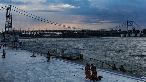 Monsoon clouds gather over the Ganga River near Ram Jhula and Janaki Setu suspension bridges during the evening in Rishikesh, Uttarakhand, Thursday, Sept. 3, 2026.