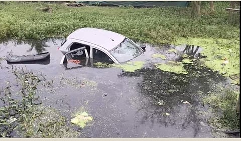 The partially submerged car