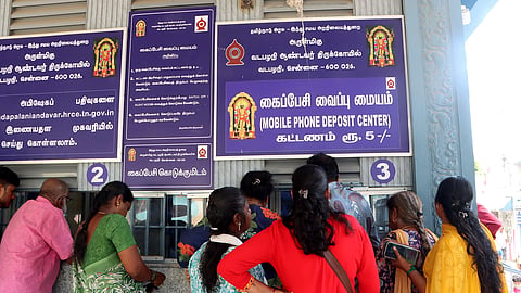 Devotees depositing their mobile phones at the designated counter at the Murugan temple in Vadapalani in Chennai.