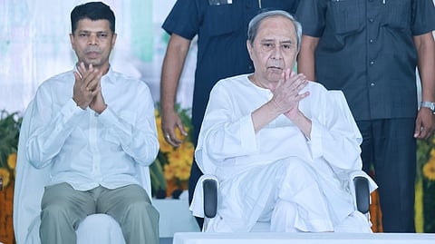 VK Pandian (L) and former Odisha CM Naveen Patnaik.