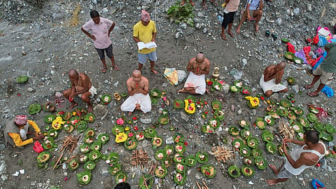 People whose relatives remain missing following flash floods perform rituals after symbolic funeral rites on the banks of the swollen Trishuli River in Nepal's Nuwakot district, Wednesday, Sept. 2, 2026.