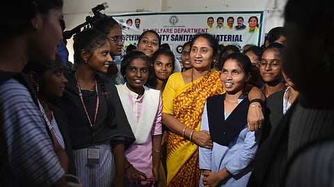 BC Welfare ministerS Savitha interacts with the inmates of the BC Welfare hostel at Gunadala where she arrives and hands over the sanitation kits to the workers in Vijayawada on Wednesday.