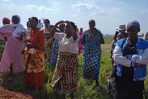 Women weep as they attend the burial ceremony of Neema Minaro, a 66 year old woman who died of the Ebola virus, in Bunia, Congo, Wednesday, Sept. 2, 2026. 