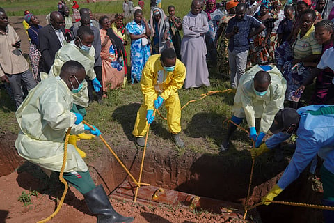 Health workers bury the coffin of Neema Minaro, a 66 year old woman who died of the Ebola virus, in Bunia, Congo, Wednesday, Sept. 2, 2026. 
