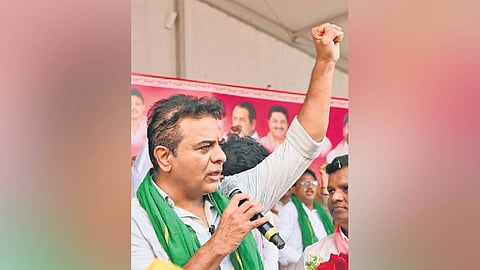 BRS working president KT Rama Rao speaks during a dharna by the party demanding release of water for irrigation at Miriyalaguda.