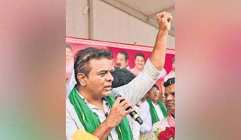 BRS working president KT Rama Rao speaks during a dharna by the party demanding release of water for irrigation at Miriyalaguda.