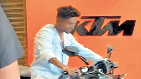 Screengrab from a video of the boy and his new bike  