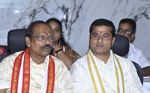 SDMSD EO VK Seena Naik and chairman Borra Radha Krishna during the committee meeting on Thursday. 
