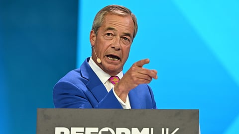 Reform Party Leader Nigel Farage points as he speaks during the Reform party's annual conference at the National Exhibition Centre in Birmingham, England, Friday, Sept. 4, 2026.