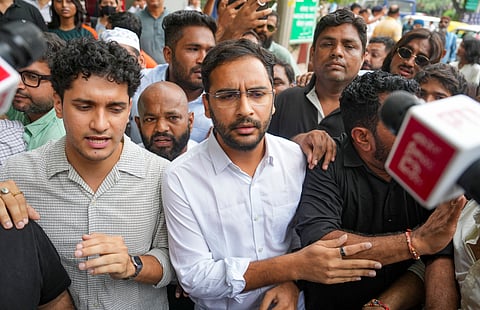 Cockroach Janta Party (CJP) spokespersons Saurav Das and Ashutosh Ranka along with party supporters move towards the Parliament Street police station as they stage a protest, demanding action against self-styled Hindutva influencer Swatantra Bhardwaj over the alleged assault of a student protester's father, in New Delhi, Friday, Sept. 4, 2026.