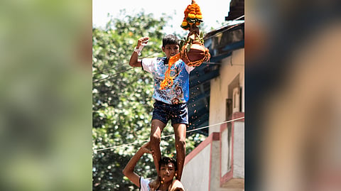 A child breaks a handi as he celebrates the Dahi Handi on the occasion of the Shri Krishna Janmashtami festival, Dadar, in Mumbai on Saturday, Sept 05, 2026.