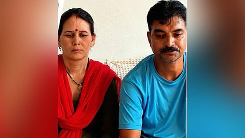 Nepal flash flood survivor Gain Singh, along with his wife at his hometown.