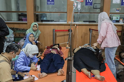 Students who fell ill allegedly due to food poisoning after consuming free meals at their school receive medical treatment at a hospital in Sidoarjo, East Java, Indonesia, Wednesday, Sept. 2, 2026. 