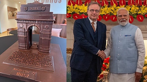 (L) The India Gate model made of Belgian chocolate; (R) Prime Minister Narendra Modi with his Belgian counterpart Bart De Wever in New Delhi on Friday.