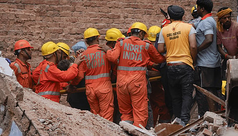 Rescue operation underway after a building collapsed at Satya Niketan area, in New Delhi, Sunday, Sept. 6, 2026. 