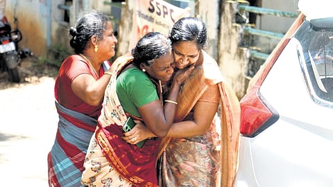 A mother breaks down after seeing the body of her son, one of the eight engineering students killed in the Kaipamangalam road accident, at Thrissur Government Medical College Hospital.