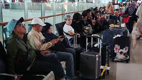 Travelers wait for their flights at Soekarno-Hatta International Airport in Tangerang, Indonesia, Sunday, Sept. 6, 2026.