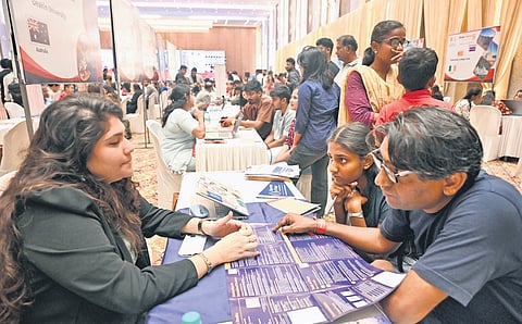 Students explore their options to study at 
foreign universities during the expo at Palace Grounds on Sunday 
| Nagaraja Gadekal