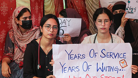 MBBS and BDS interns of Government Medical College hold placards during a protest demanding an increase in their monthly stipend, in Jammu, Jammu and Kashmir, Saturday, Sept. 5, 2026.