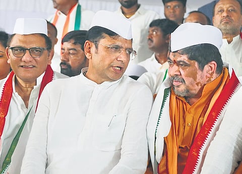 Cabinet ministers D Sridhar Babu, Mohammed Azaruddin and Ponnam Prabhakar take part in a dharna at Dharna Chowk demanding Resignation of former Chief Minister K Chandrashekar Rao in Hyderabad on Sunday.