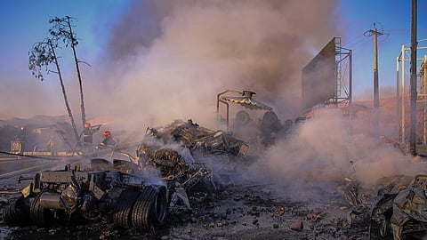 Firefighters work at the scene after a fuel tanker struck several vehicles and burst into flames near Sanandaj, western Iran, Saturday Sept. 5, 2026.