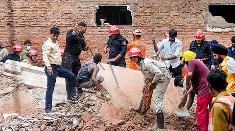 Rescue operation underway after a five-storey building collapsed at Satya Niketan area, in New Delhi, Sunday, Sept. 6, 2026.