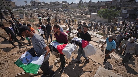 Mourners carry the flag-draped bodies of Palestinians killed in Israeli strikes in the war with Hamas, whose remains were recently recovered from the rubble, during their funeral in Gaza City, Sunday, Sept. 6, 2026.