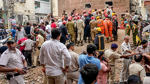 Rescue operation underway after a building collapsed at Satya Niketan area, in New Delhi, Sunday, Sept. 6, 2026.