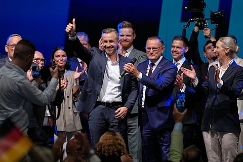 Top candidate Ulrich Siegmund shows thumbs up beside party leaders Tino Chrupalla and Alice Weidel, from left, at an election party of the "Alternative for Germany" (AfD) after the Saxony-Anhalt state elections in Magdeburg, eastern Germany, Sunday, Sept. 6, 2026.